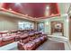 Home theater with reclining leather seats and large screen at 5764 Amber Ridge Dr, Castle Pines, CO 80108