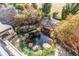 Peaceful backyard water feature with stone accents and lush landscaping at 5764 Amber Ridge Dr, Castle Pines, CO 80108