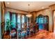 Formal dining room with hardwood floors and a built-in hutch at 5764 Amber Ridge Dr, Castle Pines, CO 80108
