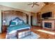 Luxurious main bedroom with fireplace and private balcony at 5764 Amber Ridge Dr, Castle Pines, CO 80108