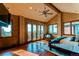 Large main bedroom with access to private balcony and scenic views at 5764 Amber Ridge Dr, Castle Pines, CO 80108
