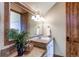 Bathroom with granite countertop, tiled backsplash, and a sink at 5764 Amber Ridge Dr, Castle Pines, CO 80108
