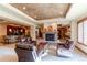 Relaxing basement lounge with fireplace and seating at 5764 Amber Ridge Dr, Castle Pines, CO 80108