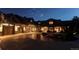 Exterior view of home at night, showcasing architectural details and landscaping at 5764 Amber Ridge Dr, Castle Pines, CO 80108