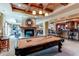 Basement game room with pool table and bar at 5764 Amber Ridge Dr, Castle Pines, CO 80108