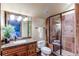 Bathroom with granite countertop, tiled shower, and a sink at 5764 Amber Ridge Dr, Castle Pines, CO 80108