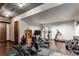 Basement home gym with weight equipment, cardio machines, and storage at 5764 Amber Ridge Dr, Castle Pines, CO 80108