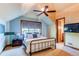 Bedroom with metal bed frame and ensuite bathroom access at 5764 Amber Ridge Dr, Castle Pines, CO 80108