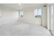 Second bedroom with sliding door to balcony and city views at 1313 Steele St # 801, Denver, CO 80206