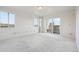 Bright bedroom with access to a private balcony and city views at 1313 Steele St # 801, Denver, CO 80206