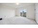 Bedroom with sliding doors leading to a private balcony at 1313 Steele St # 801, Denver, CO 80206