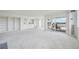 Bright living room with built-in shelving and access to a patio at 1313 Steele St # 801, Denver, CO 80206
