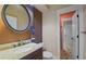 Basement bathroom with a vanity, toilet and access to a shower at 17027 Pale Anemone St, Parker, CO 80134