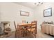 Bright dining area with a wooden table and four chairs at 7755 E Quincy Ave # 101, Denver, CO 80237