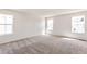 Spacious, unfurnished bedroom with plush carpet and ample natural light at 9300 Bahama Ct, Commerce City, CO 80022