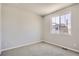 Bright bedroom featuring neutral walls and carpet at 6850 Merseyside Ln, Castle Pines, CO 80108