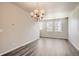 Bright dining room featuring hardwood floors and large windows at 6850 Merseyside Ln, Castle Pines, CO 80108