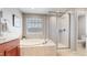 Spa-like bathroom with a large walk-in shower and a relaxing soaking tub at 27656 E Alder Dr, Aurora, CO 80016