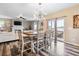 Bright dining area features a farmhouse table and chairs, with access to the kitchen and living room at 944 Mcmurdo Cir, Castle Rock, CO 80108
