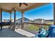 Deck with seating area, mountain views, and built-in grill at 944 Mcmurdo Cir, Castle Rock, CO 80108