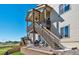 Two-story home with deck and stairs leading to backyard at 944 Mcmurdo Cir, Castle Rock, CO 80108