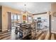 Modern kitchen with white cabinets, stainless steel appliances, and an eat-in island at 944 Mcmurdo Cir, Castle Rock, CO 80108