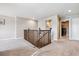 Spacious upper landing with a staircase and laundry room access at 944 Mcmurdo Cir, Castle Rock, CO 80108