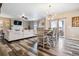 Open concept dining area with a farmhouse table and chandelier at 944 Mcmurdo Cir, Castle Rock, CO 80108