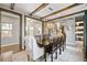 Elegant dining room with exposed beams, a large table, and hardwood floors at 1214 S Fillmore St, Denver, CO 80210