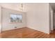 Simple dining room with hardwood floors and a chandelier at 2800 S Yates St, Denver, CO 80236