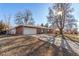 Brick ranch home with attached garage and driveway at 2800 S Yates St, Denver, CO 80236