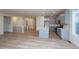 Open concept living space showcasing hardwood floors and kitchen at 1837 Water Birch Way, Castle Rock, CO 80108