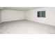 Unfinished basement with neutral carpeting and large window at 1837 Water Birch Way, Castle Rock, CO 80108