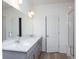 Modern bathroom with double vanity and a walk-in shower at 1837 Water Birch Way, Castle Rock, CO 80108