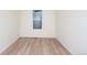 Small bedroom with light wood laminate flooring and a window at 1837 Water Birch Way, Castle Rock, CO 80108