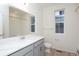 Modern bathroom with gray vanity, white countertop, and a shower/tub combo at 1837 Water Birch Way, Castle Rock, CO 80108