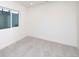 Bright, spacious basement room with neutral carpeting and large window at 1837 Water Birch Way, Castle Rock, CO 80108