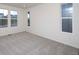 Bright bedroom with neutral carpeting and large windows at 1837 Water Birch Way, Castle Rock, CO 80108