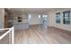 Spacious living room with hardwood floors and access to patio at 1837 Water Birch Way, Castle Rock, CO 80108