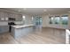 Modern kitchen with gray cabinets, quartz countertops, and stainless steel appliances at 1837 Water Birch Way, Castle Rock, CO 80108