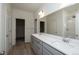 Double vanity bathroom with gray cabinets and quartz countertops at 1837 Water Birch Way, Castle Rock, CO 80108