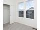 Simple bedroom with a closet and large windows at 1837 Water Birch Way, Castle Rock, CO 80108