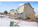 House exterior with snowy backyard and patio at 24650 E Wyoming Cir, Aurora, CO 80018