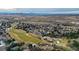 Aerial view of houses near a golf course and highway at 244 Cheney Pl, Castle Rock, CO 80104