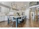 Spacious kitchen boasts a large island, white cabinets, and stainless steel appliances at 244 Cheney Pl, Castle Rock, CO 80104