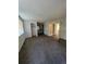 Bright bedroom with carpet, mirrored vanity, and built-in closet at 2721 S Salida Way, Aurora, CO 80013