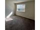 Bright bedroom featuring neutral carpeting and a window at 2721 S Salida Way, Aurora, CO 80013