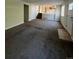 Spacious living area with carpet, neutral walls, and access to the kitchen at 2721 S Salida Way, Aurora, CO 80013