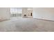 Living room with neutral carpeting, and sliding doors to balcony at 660 S Alton Way # 5C, Denver, CO 80247