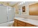 Bright bathroom featuring a shower/tub combo and wood vanity at 660 S Alton Way # 5C, Denver, CO 80247